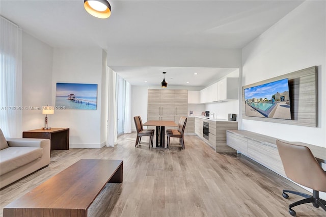 living room with light hardwood / wood-style floors