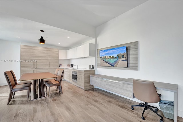 dining space with recessed lighting and light wood-style floors