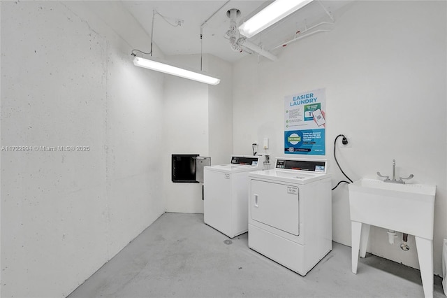 common laundry area with washing machine and clothes dryer