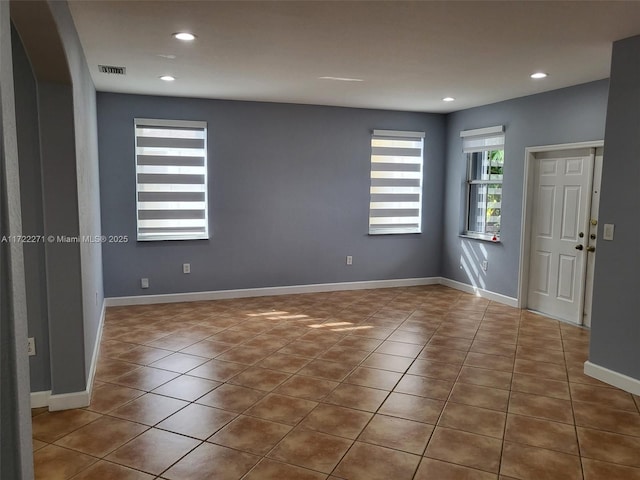 spare room featuring tile patterned flooring