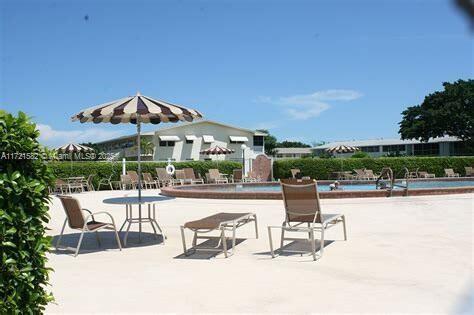 view of community featuring a patio area and a swimming pool