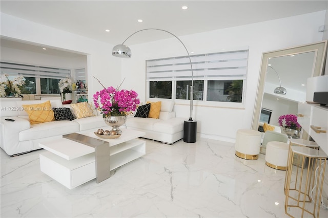 living room featuring marble finish floor and recessed lighting