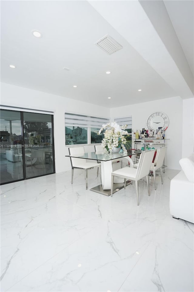 dining area with recessed lighting, marble finish floor, and visible vents