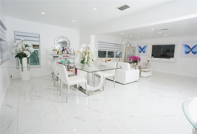 dining space featuring marble finish floor, visible vents, and recessed lighting