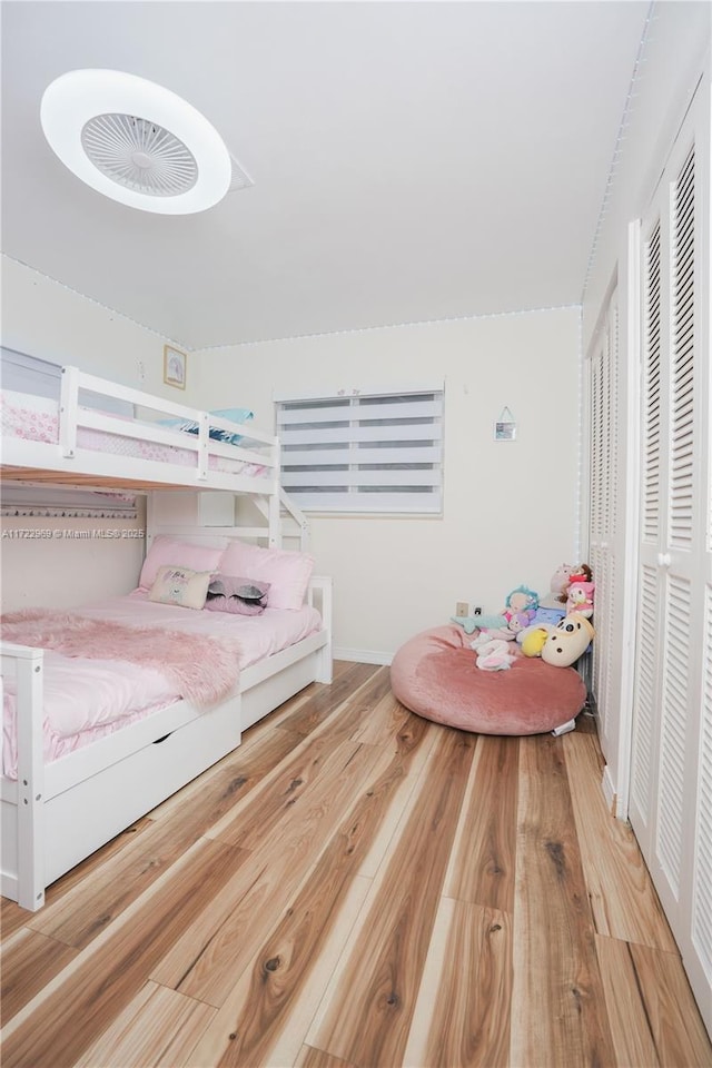 bedroom with a closet and wood finished floors