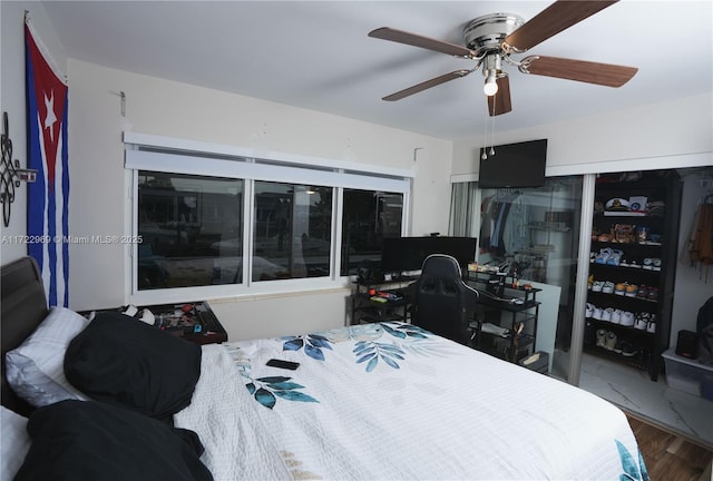 bedroom featuring ceiling fan and wood finished floors