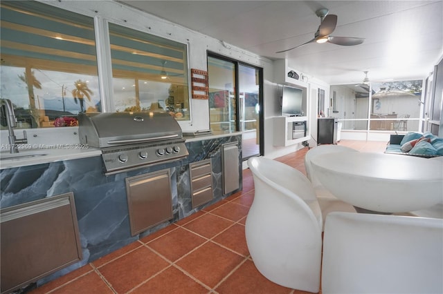 view of patio / terrace featuring a sink, a grill, area for grilling, and ceiling fan