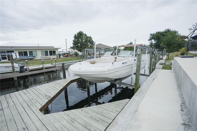 view of dock featuring a water view and boat lift