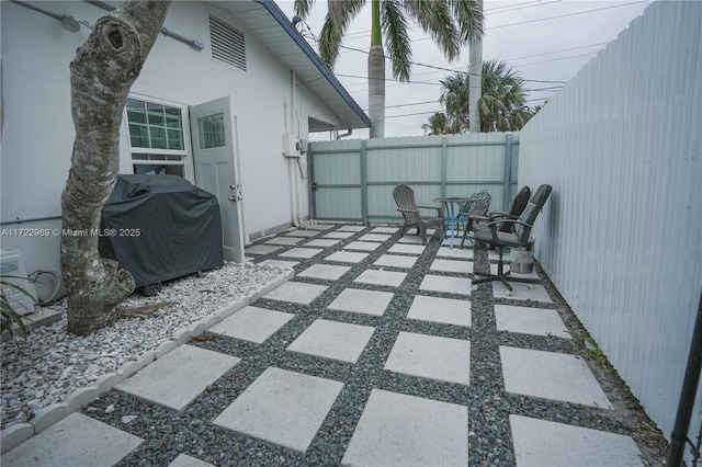 view of patio / terrace featuring area for grilling and a fenced backyard