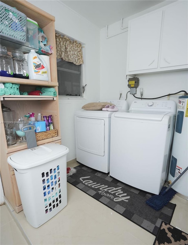 washroom with washer and clothes dryer, cabinet space, and electric water heater