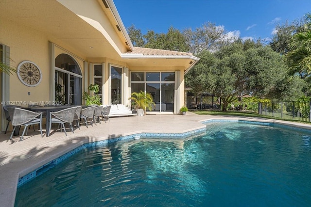 view of swimming pool featuring a patio