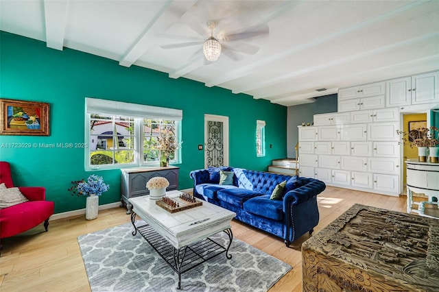 living room with beam ceiling, ceiling fan, and light hardwood / wood-style floors