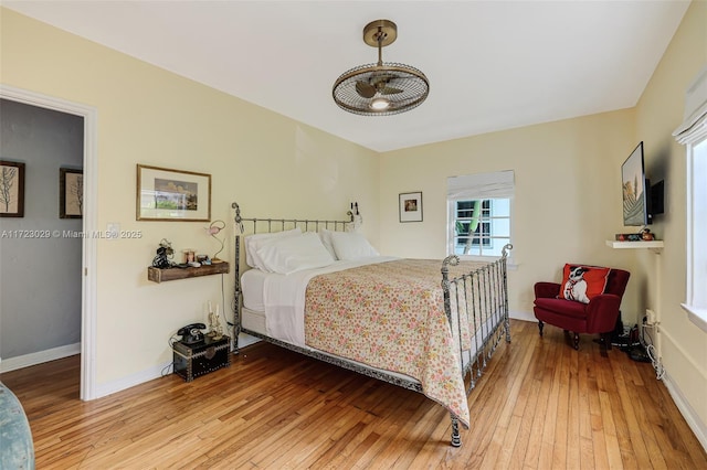 bedroom with hardwood / wood-style flooring