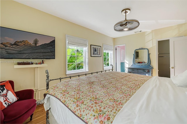 bedroom with wood-type flooring