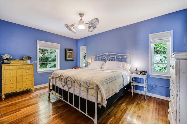 bedroom featuring wood-type flooring and ceiling fan