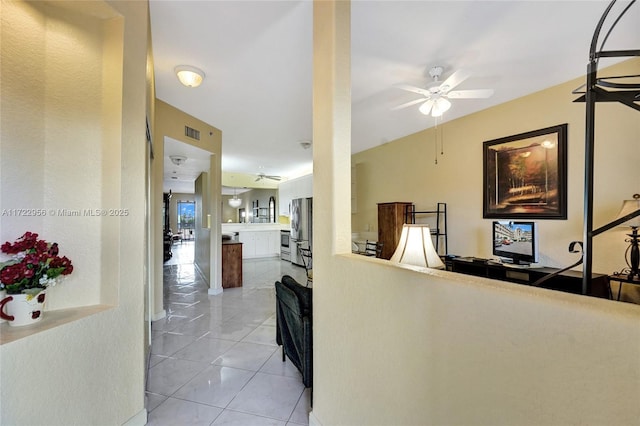 hall featuring light tile patterned flooring