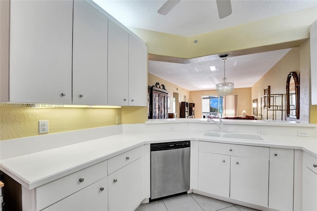 kitchen with dishwasher, kitchen peninsula, white cabinetry, and sink