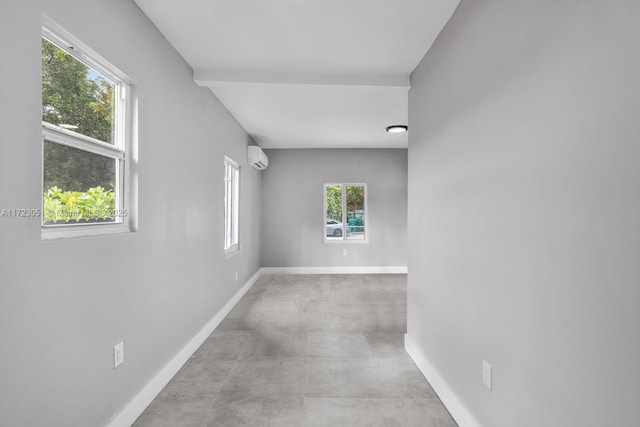 empty room featuring an AC wall unit