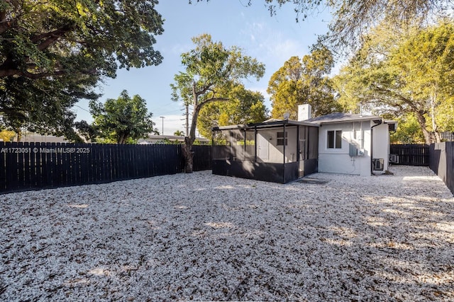 view of yard with a sunroom