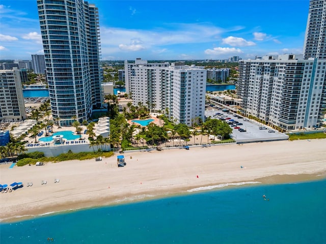 bird's eye view featuring a view of the beach, a view of city, and a water view