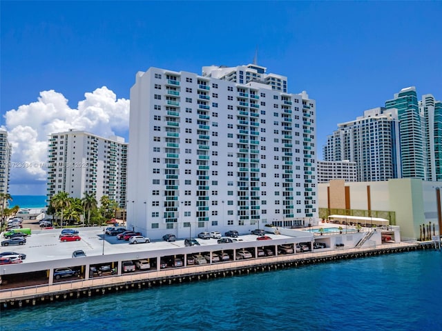 exterior space featuring a view of city and a water view