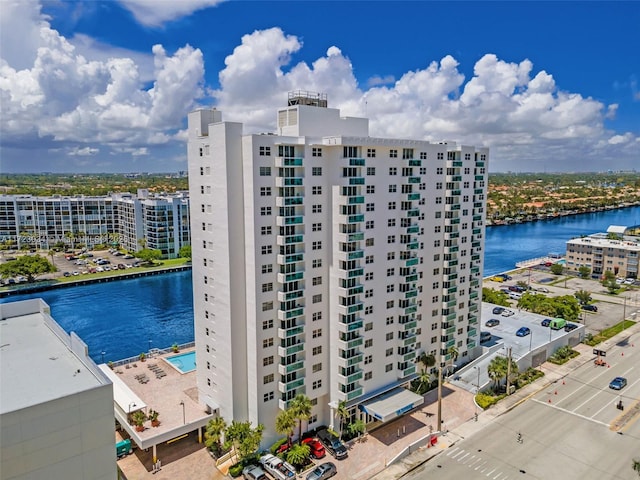 bird's eye view featuring a water view and a view of city