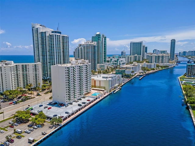 birds eye view of property featuring a view of city and a water view