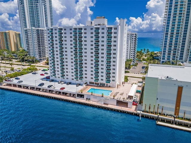 aerial view featuring a water view and a city view