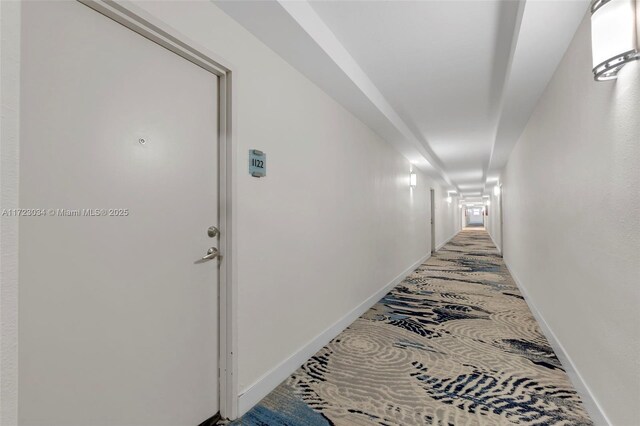 corridor featuring baseboards