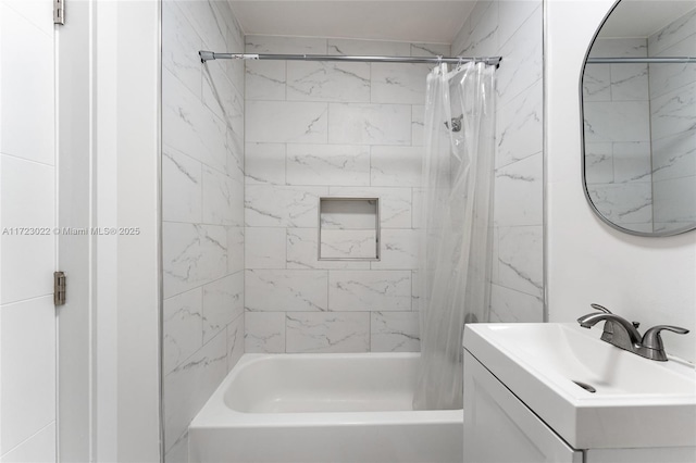 bathroom featuring vanity and shower / bath combination with curtain