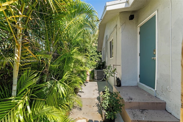 property entrance with central AC unit