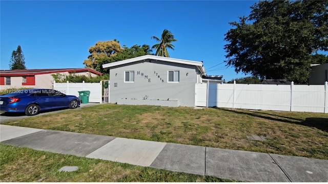 view of home's exterior featuring a yard