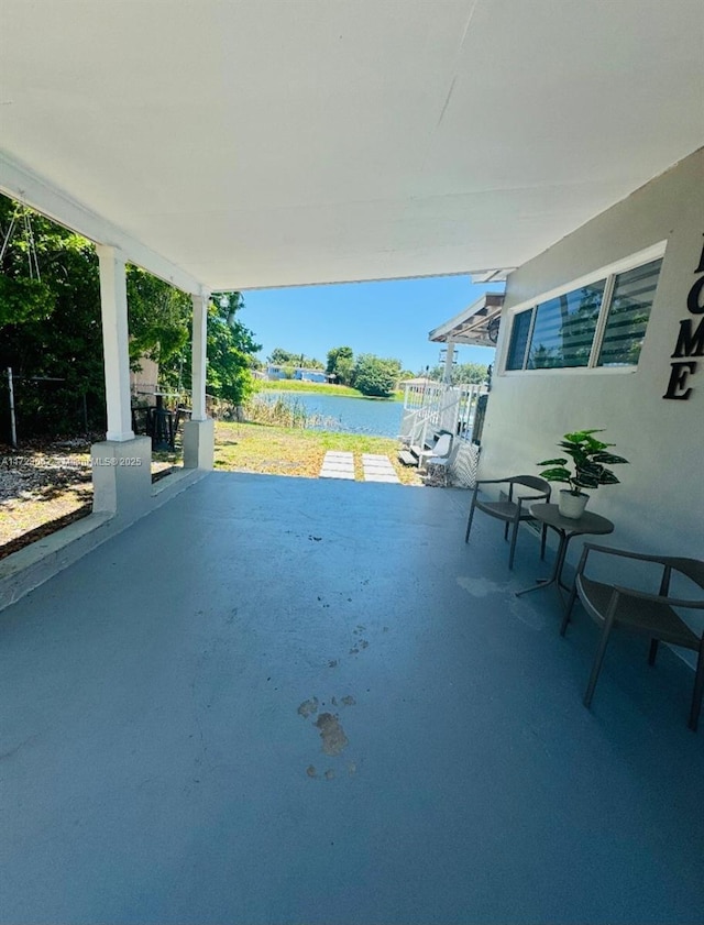 view of patio / terrace with a water view