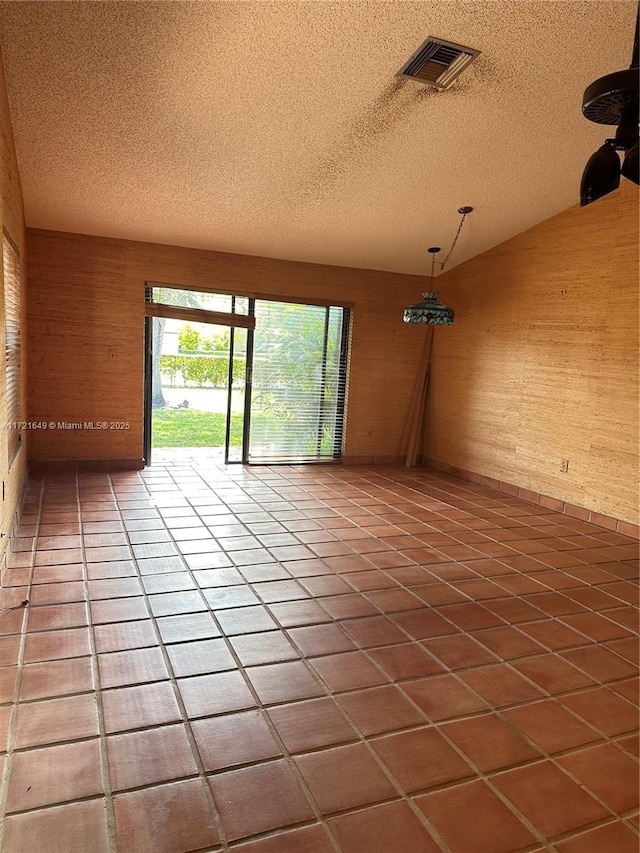 unfurnished room featuring tile patterned floors