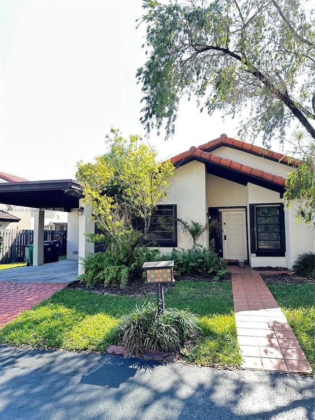 view of front facade with a carport