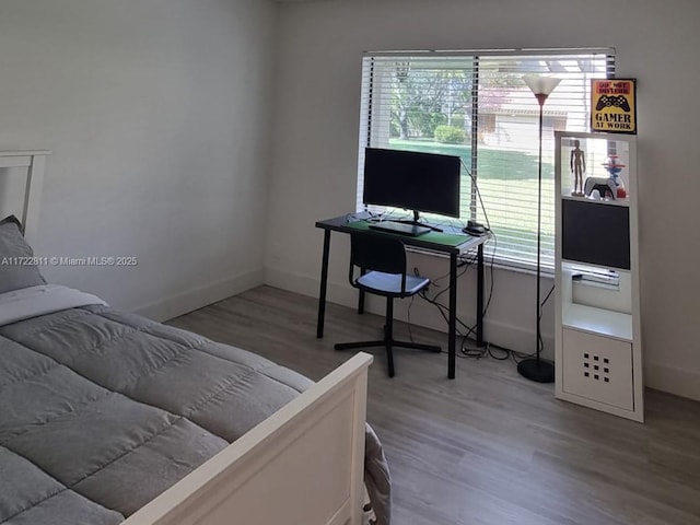 bedroom with wood-type flooring