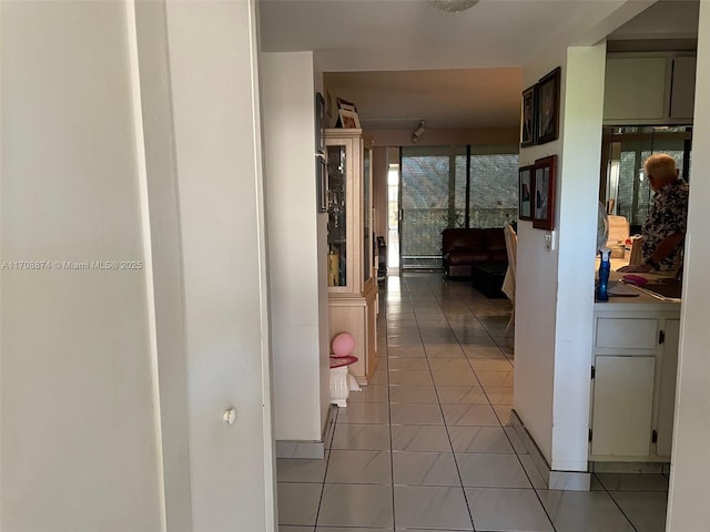 hallway featuring light tile patterned floors