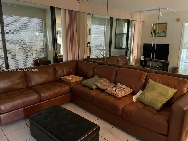 tiled living room featuring plenty of natural light