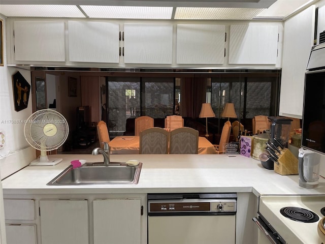 kitchen with dishwashing machine, oven, range, and sink