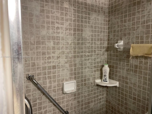 bathroom with tiled shower