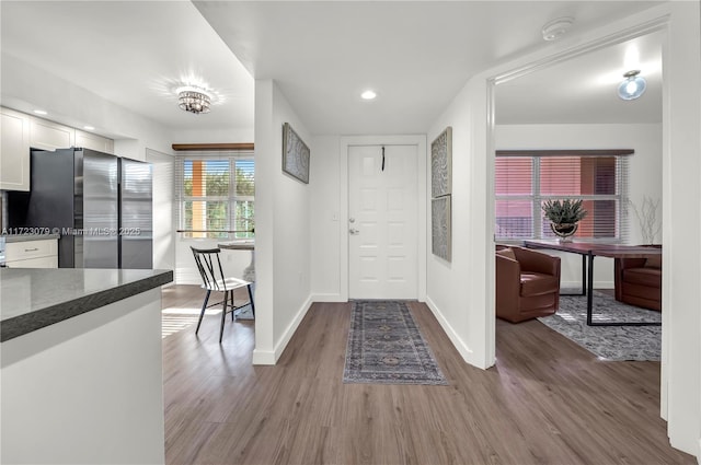 foyer entrance with light wood-type flooring