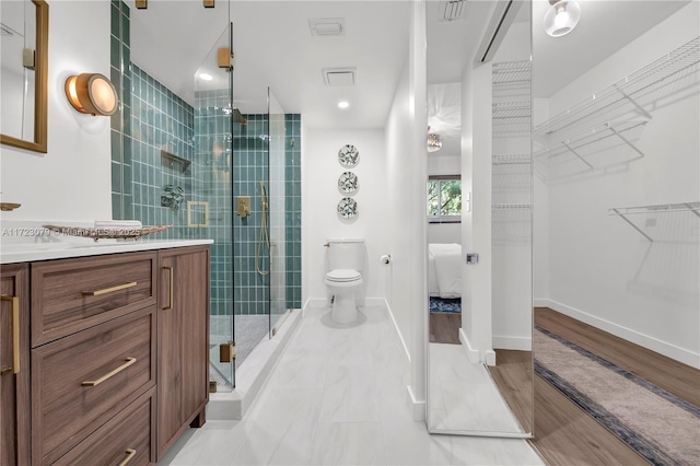 bathroom with vanity, toilet, and walk in shower