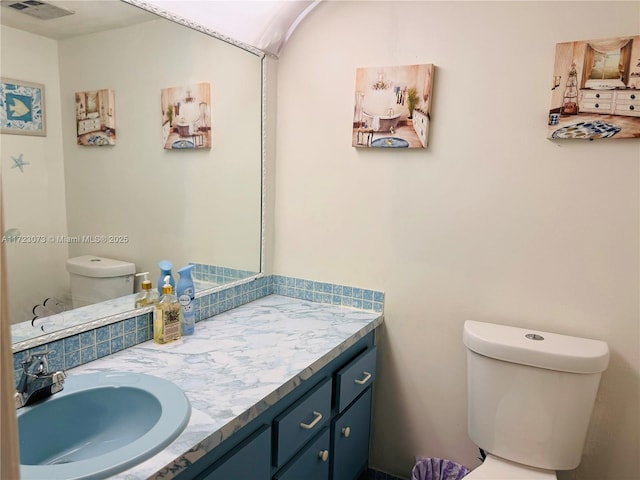 bathroom with vanity and toilet