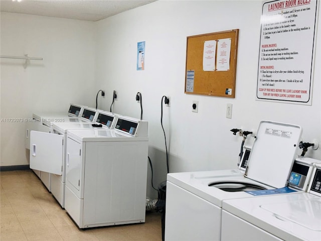 clothes washing area featuring washing machine and dryer