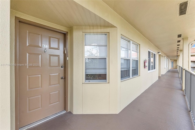 entrance to property with a balcony