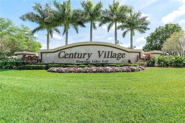 community / neighborhood sign featuring a lawn