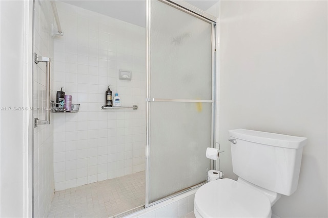 bathroom with walk in shower and toilet