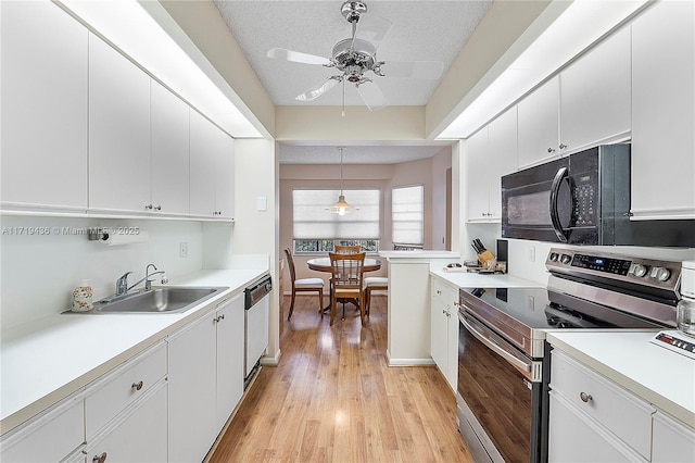 kitchen with white cabinets, ceiling fan, and stainless steel electric range oven