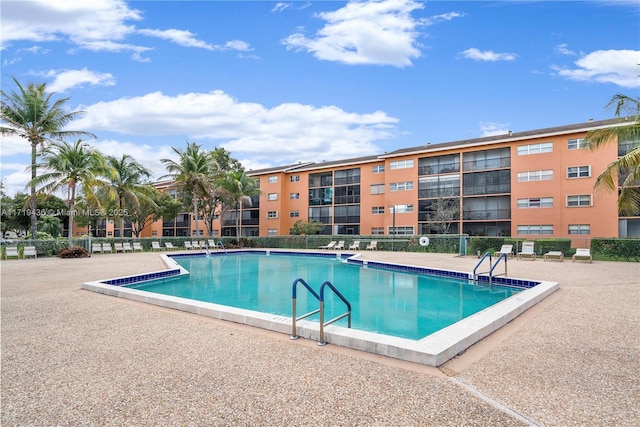 view of swimming pool featuring a patio