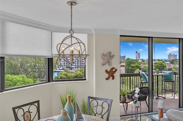 dining room featuring a notable chandelier and crown molding